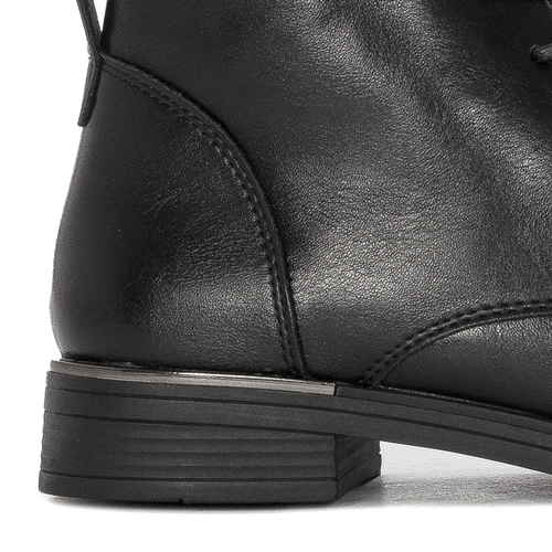 Black Sergio boots on an insulated platform