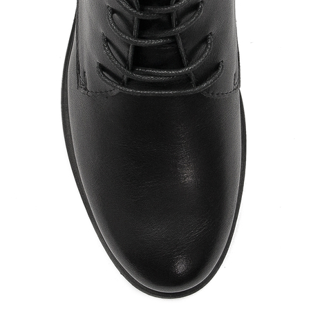 Black Sergio boots on an insulated platform
