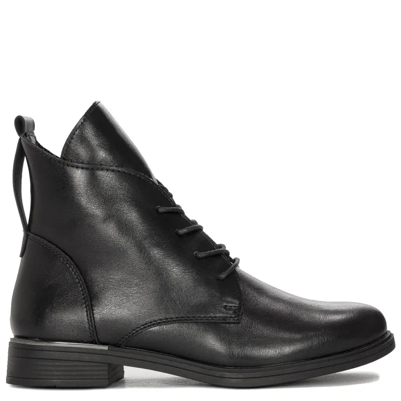 Black Sergio boots on an insulated platform